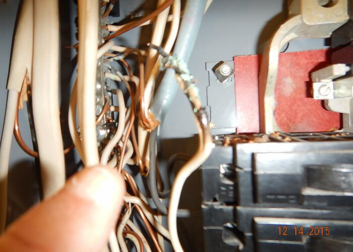 damaged and burnt conductors at service panel in arlington Office
